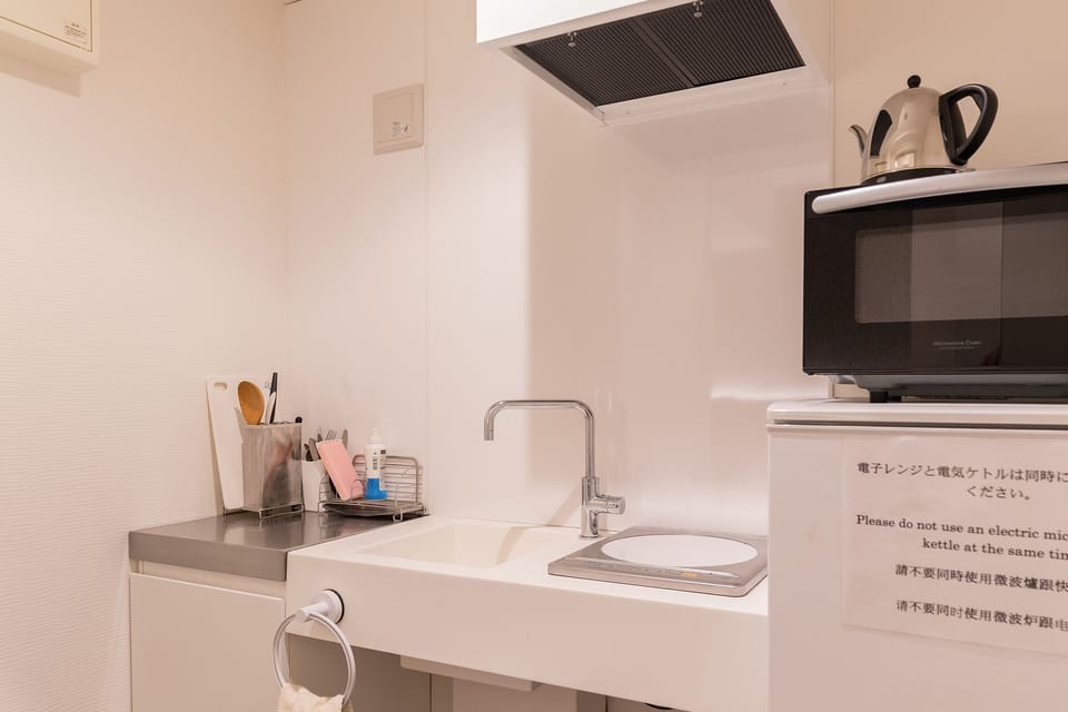 Family Room (No Housekeeping During Stay) | Private kitchenette | Fridge, microwave, electric kettle, cookware/dishes/utensils