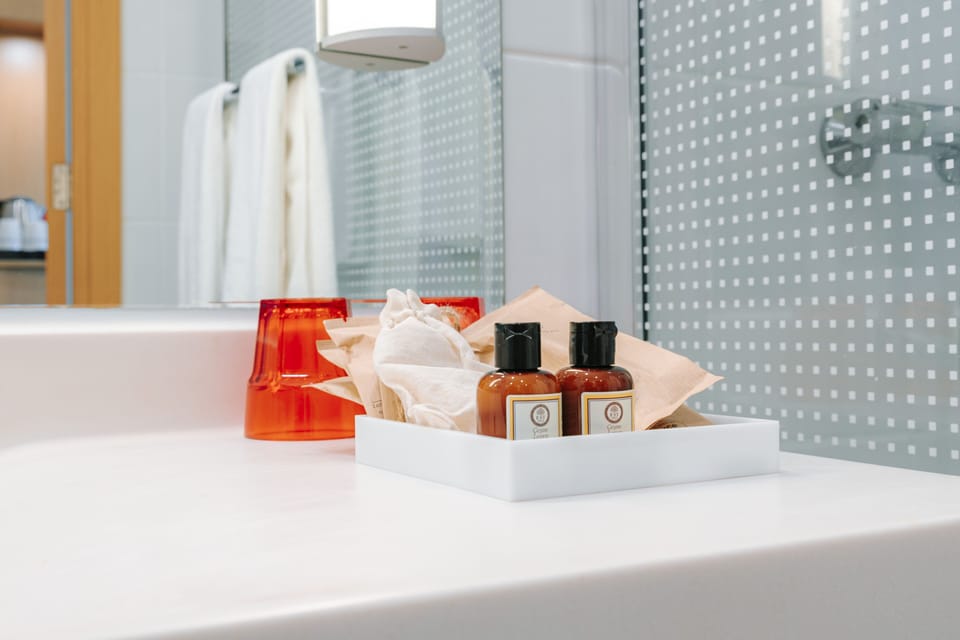 Shower, eco-friendly toiletries, hair dryer, towels