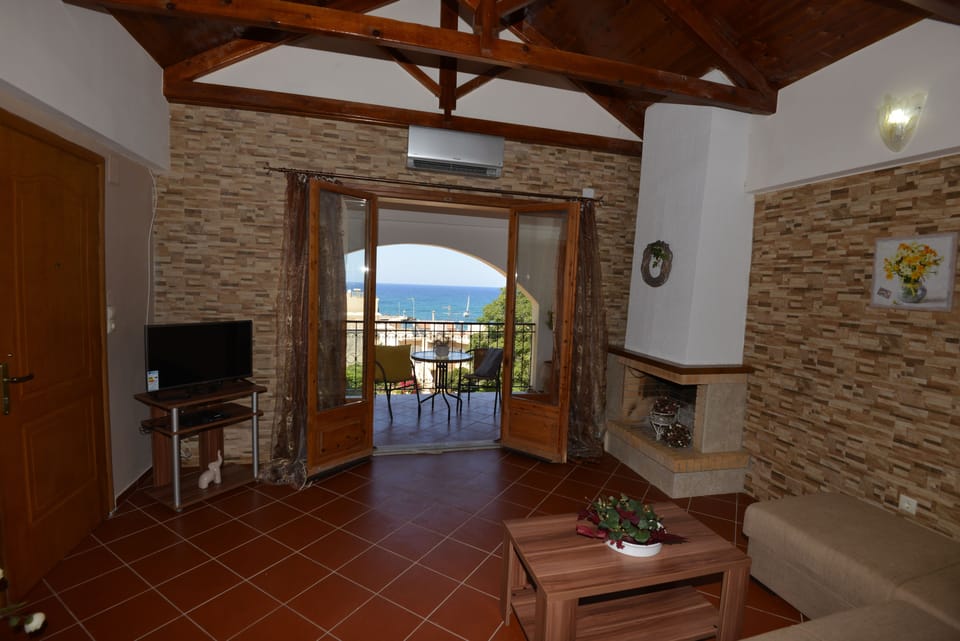 House, 1 Bedroom | Living area | 33-inch flat-screen TV with satellite channels, LED TV, fireplace