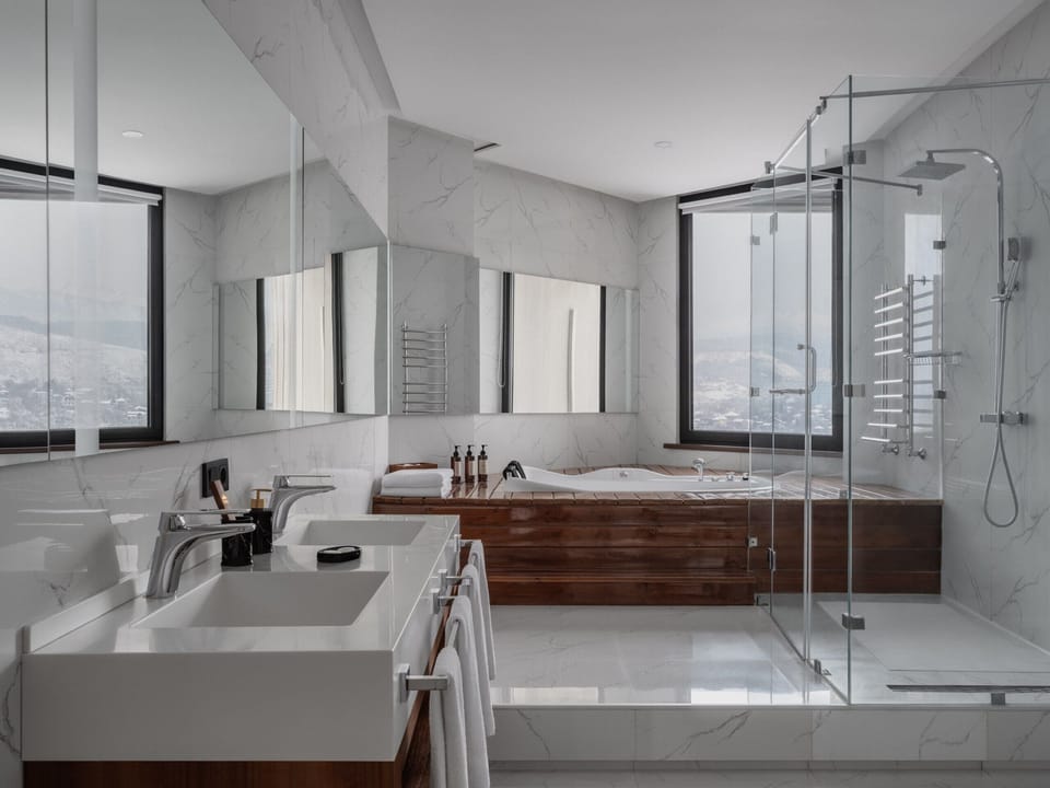Grand Suite (King) | Bathroom | Designer toiletries, hair dryer, bathrobes, slippers