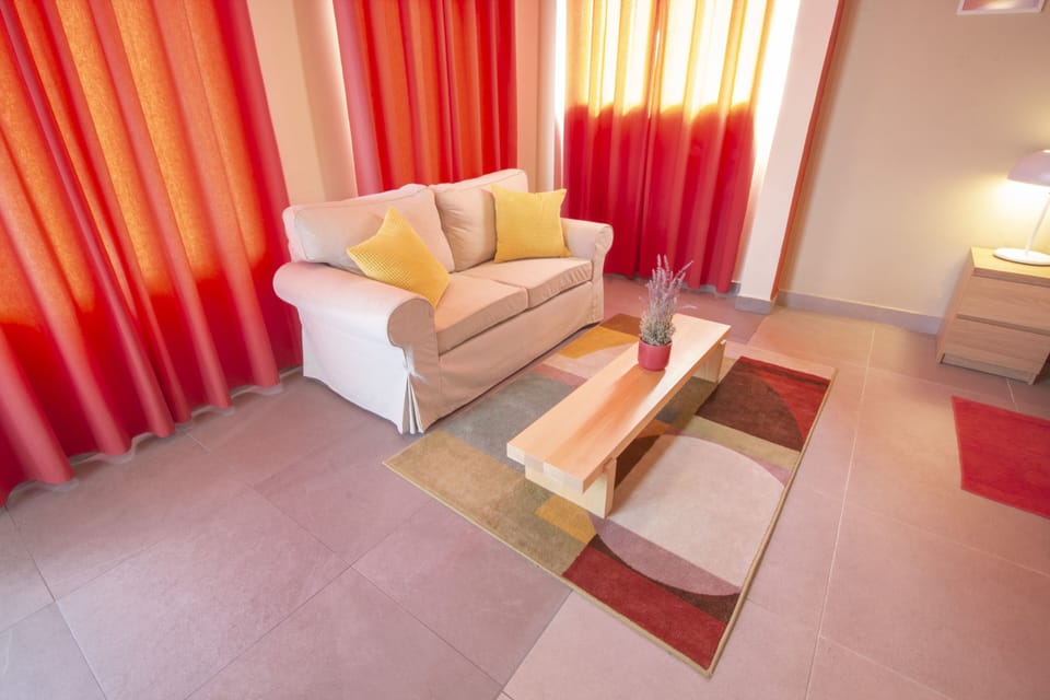 Superior Room, Terrace, Courtyard Area | Living area | 32-inch LCD TV with cable channels, TV