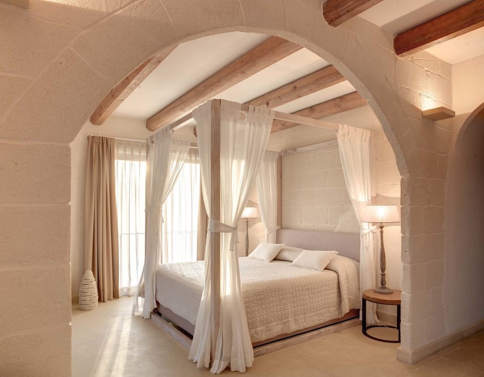 Deluxe Suite, Jetted Tub, Garden View | Premium bedding, minibar, in-room safe, iron/ironing board