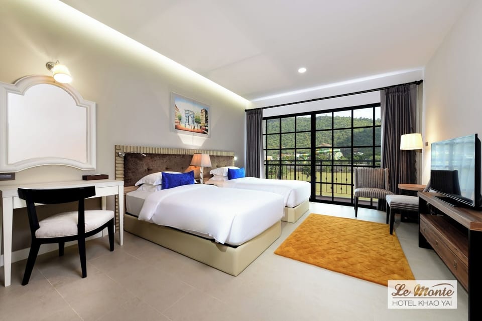 Deluxe Double Mountain View | Minibar, in-room safe, desk, blackout drapes