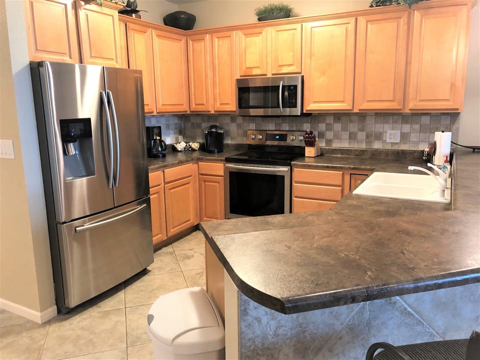 Fully equipped kitchen with new stainless steel appliances.