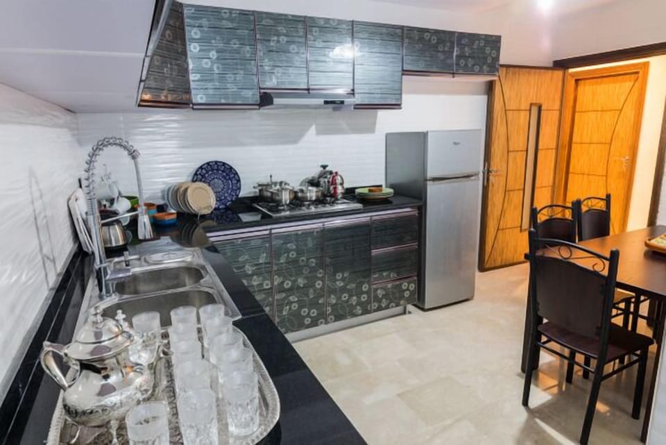 Apartment, 3 Bedrooms | Private kitchen | Full-size fridge, stovetop, cookware/dishes/utensils