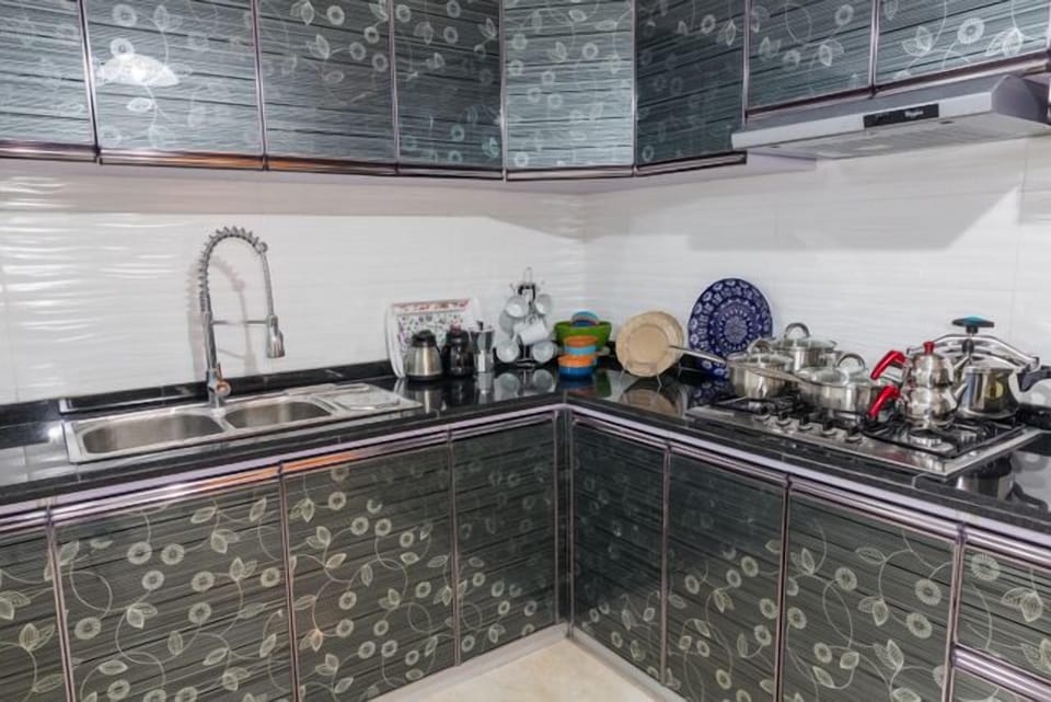 Apartment, 3 Bedrooms | Private kitchen | Full-size fridge, stovetop, cookware/dishes/utensils