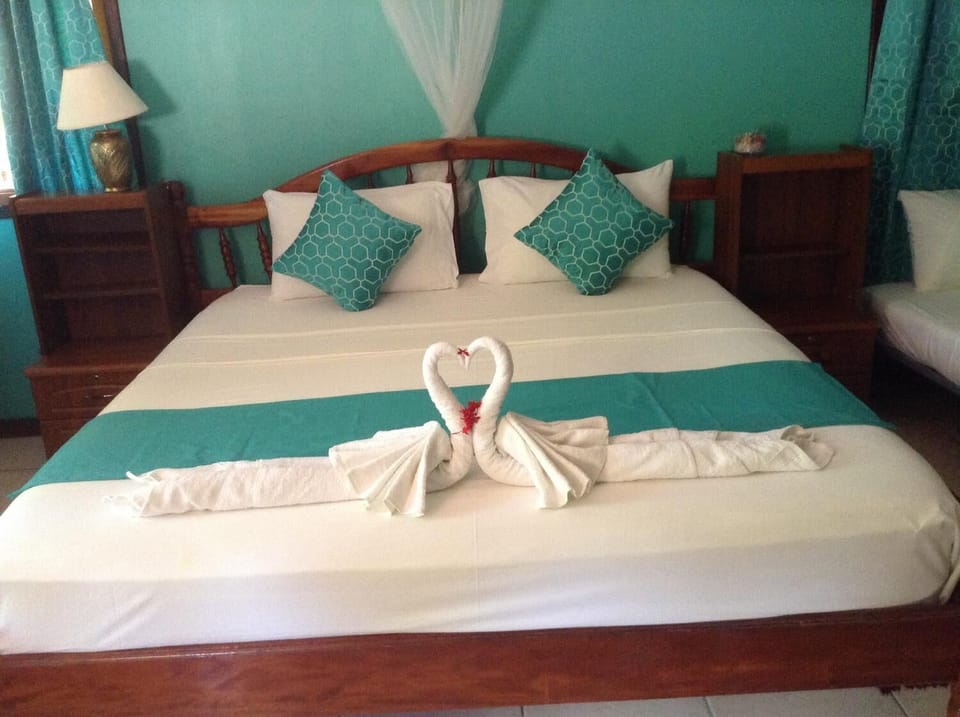 Room, Balcony | 1 bedroom, in-room safe, iron/ironing board, cribs (free)