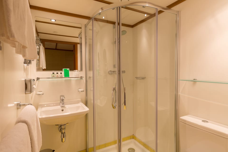 Standard Double Room, No Windows | Bathroom | Shower, eco-friendly toiletries, hair dryer, towels