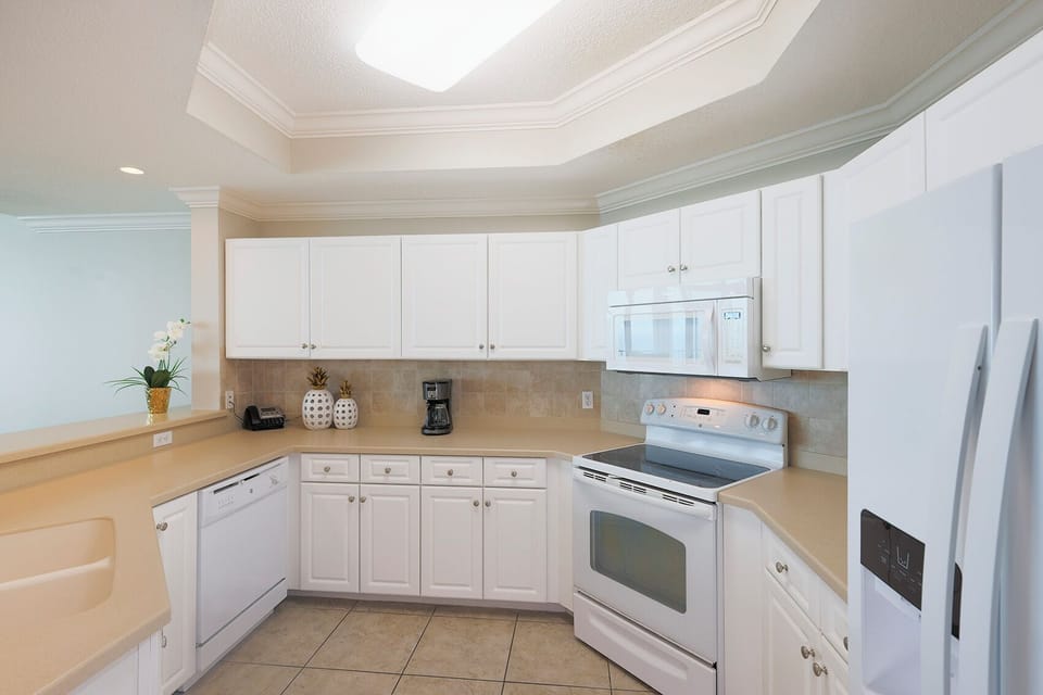 Craft delicious meals together in the bright kitchen, enjoying the seamless flow and cheerful vibe of shared moments