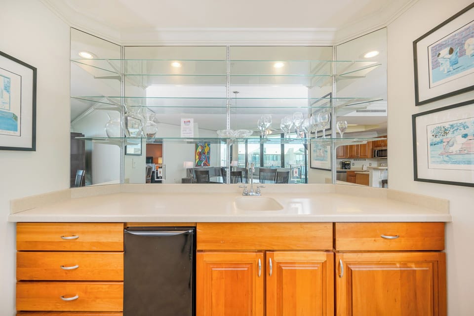Grab a chilled drink from the fridge or create your favorite cocktail at the wet bar