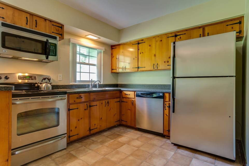 Kitchen equipped with stove, microwave, dishwasher and Frig 