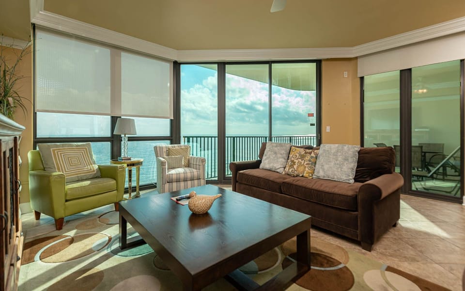 Relax in the inviting living area with plush seating, sofa with queen sleeper, and stunning views through large windows