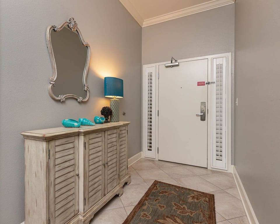 Step into this welcoming entryway, where charming decor sets the tone for your beach getaway
