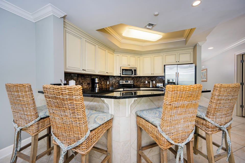 Gather with your family on the stylish bar stools, sharing laughter and creating memories in the inviting kitchen space