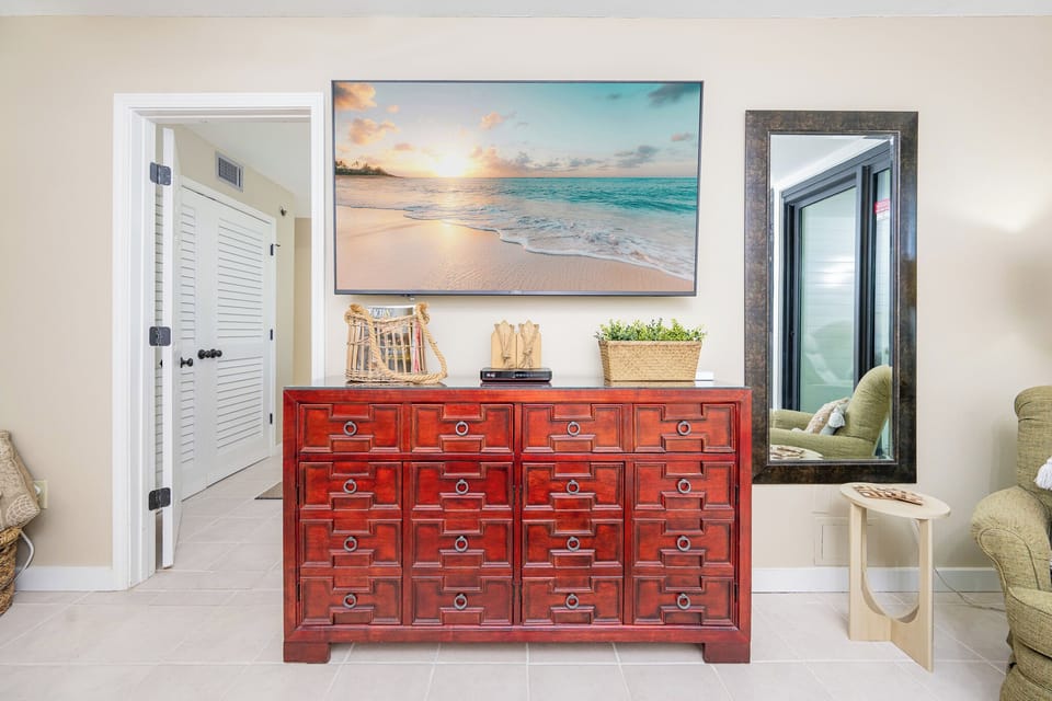 Stream your favorite shows or enjoy a family movie night after a day at the beach in this inviting living area