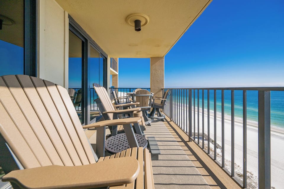 Savor your morning coffee while soaking in stunning views from your balcony's cozy seating area