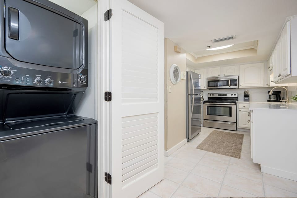 Effortlessly manage laundry during your stay with the convenient washer and dryer tucked away in this well-placed nook