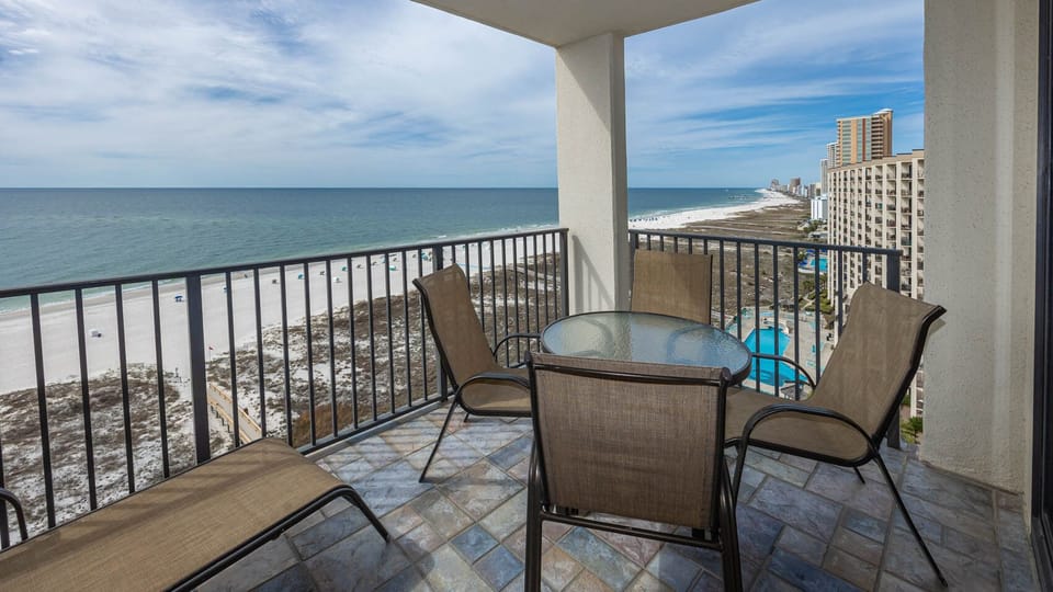 Balcony seating offers a serene view of the beach and endless gulf, perfect for enjoying the stunning evening sunsets