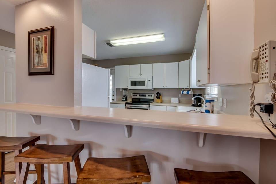 Kitchen - The kitchen offers a nice bar with seating for 4.