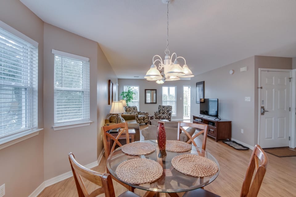 Dining Area - The dining area offers a table with seating for 4, and is open to the living area.