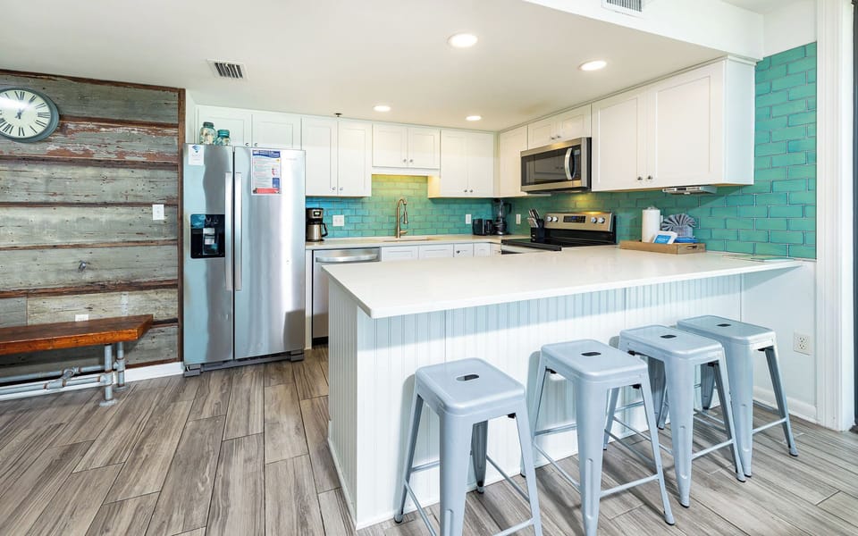 Enjoy cooking in this bright kitchen with stainless appliances and a spacious island for gathering with friends