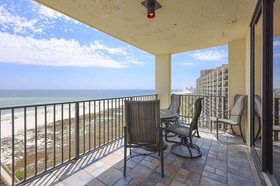 Balcony seating offers a perfect spot to enjoy the stunning beachfront view and gentle gulf breezes