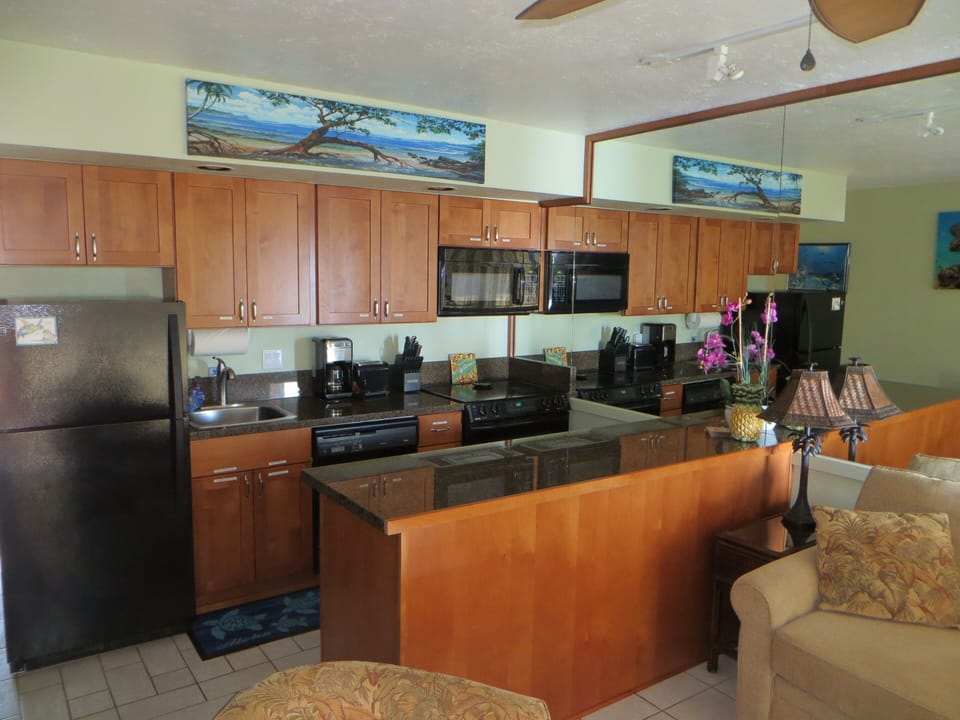 Fully stocked kitchen with ample counter space for meal preparation