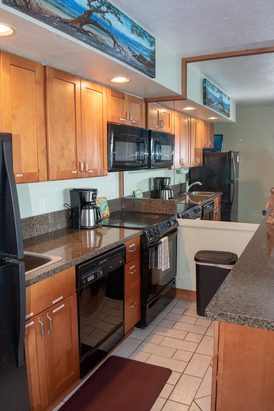Well stocked cabinets contain everything needed for your meals in the condo