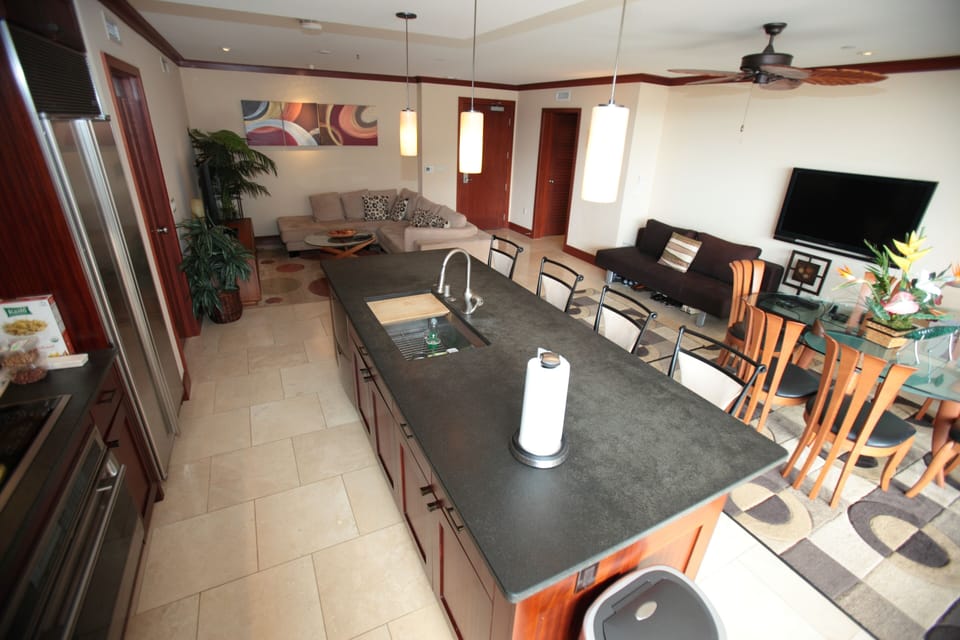 Stone kitchen counter in this waterfront vacation rental in Hawaii