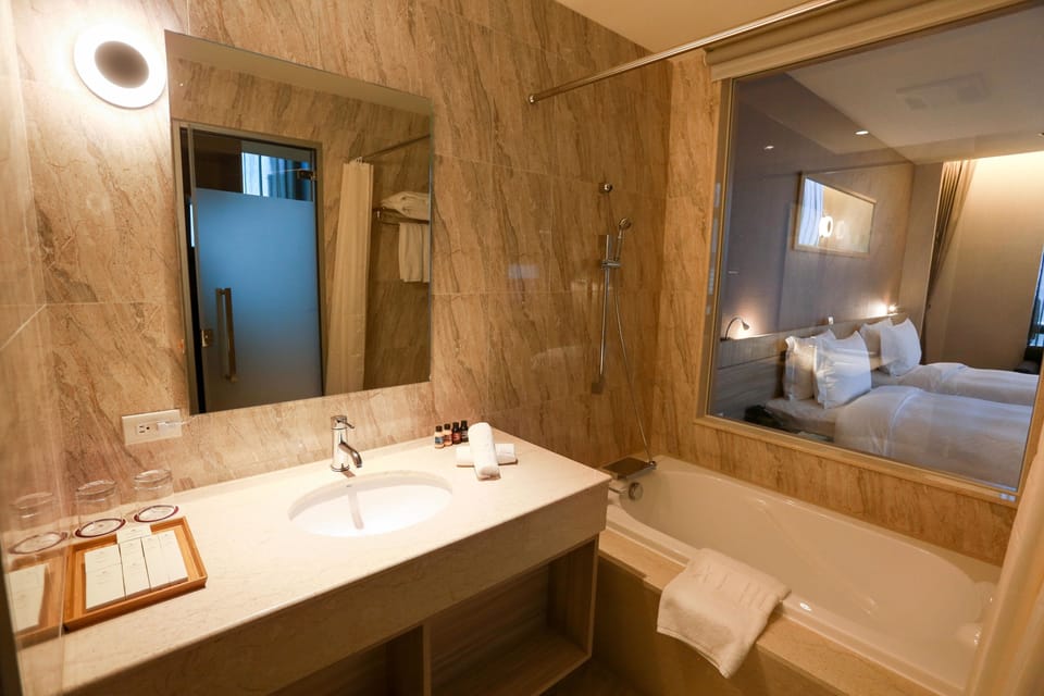 Combined shower/tub, hair dryer, towels, soap