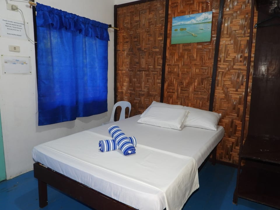 One Couple | Desk, iron/ironing board, bed sheets