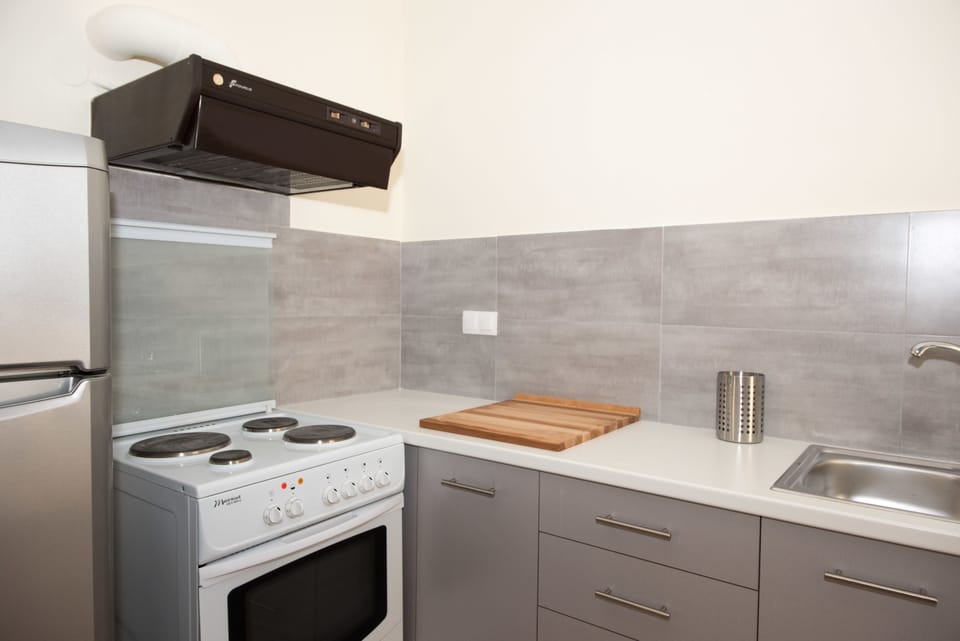 Apartment, 2 Bedrooms, Sea View | Private kitchen | Full-size fridge, oven, stovetop, coffee/tea maker