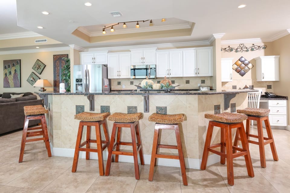 Wake up with morning coffee at the breakfast bar and get ready for a beach day in this stylish space