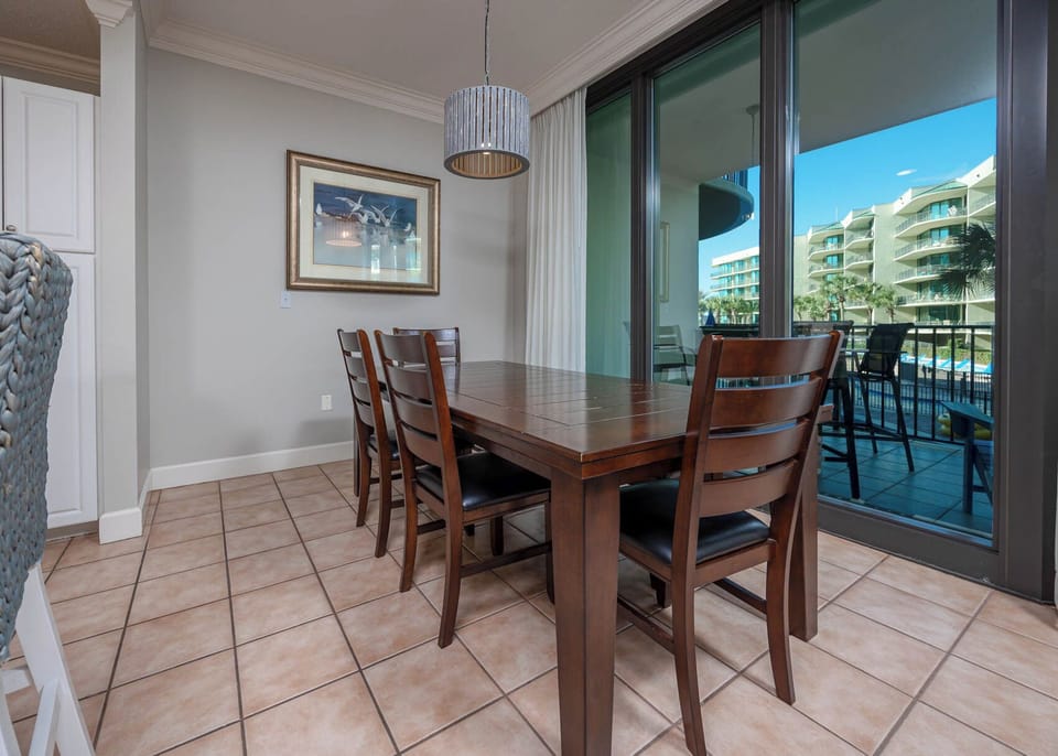 Gather around the dining table to enjoy the inviting atmosphere with views that ignite your vacation spirit