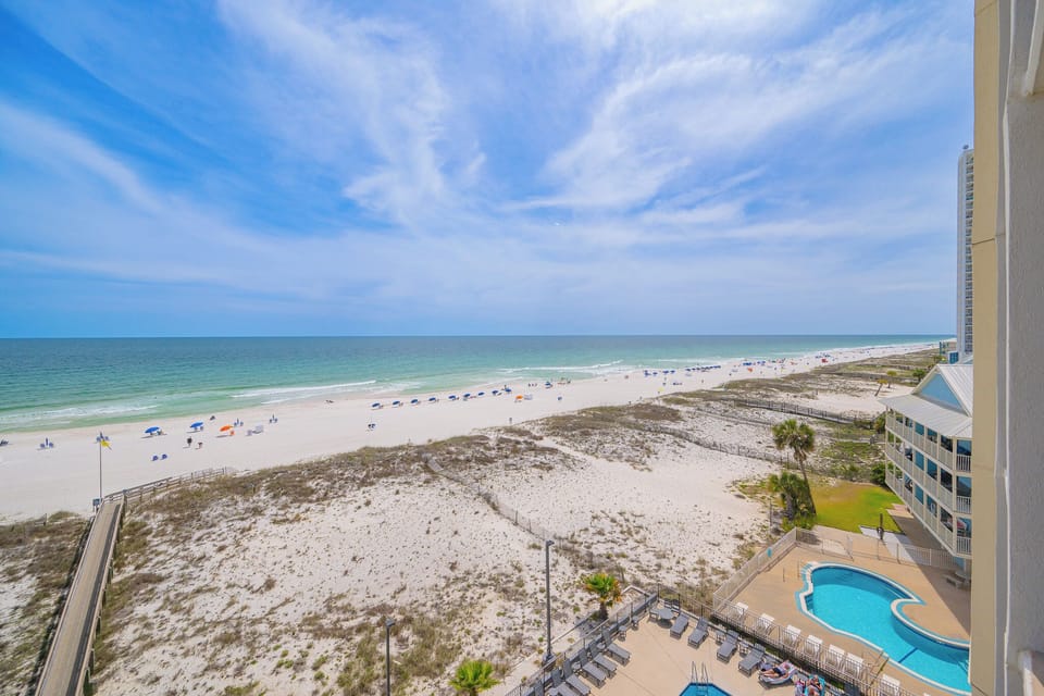 Savor stunning coastal views from your balcony, where gentle waves and beach vibes create the perfect relaxation spot