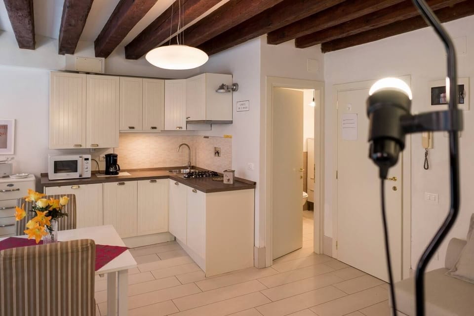 Deluxe Triple Room, Canal View | Private kitchen | Full-size fridge, microwave, stovetop, dishwasher