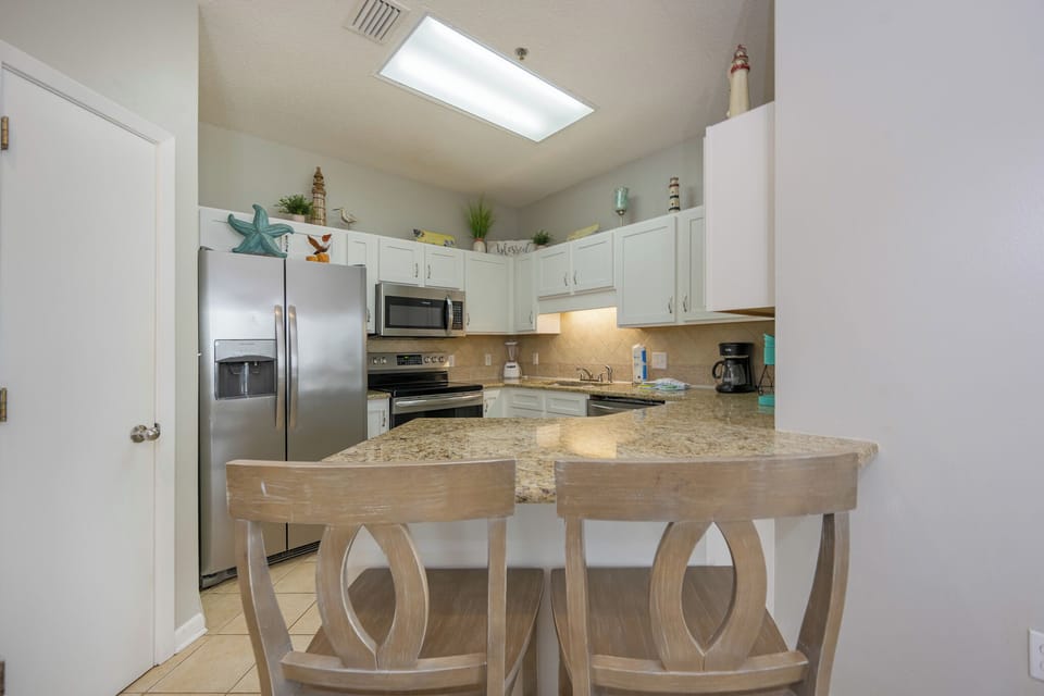 Craft delicious snacks and meals in this inviting kitchen, perfect for beach days and family fun together
