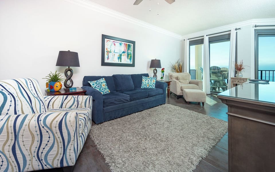 Unwind on the sofa with a queen sleeper, where vibrant decor complements the stunning coastal views