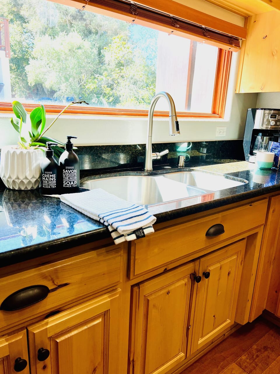 Appreciate the ease of a well-arranged kitchen that enhances the charm of your cooking endeavors.