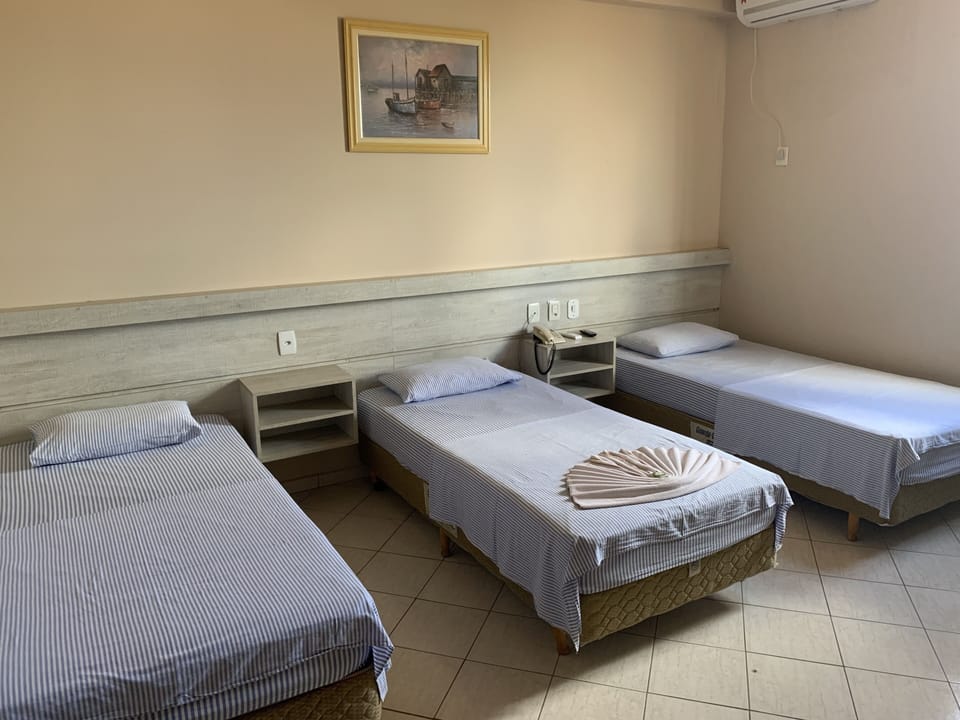 Triple Room | Minibar, desk, blackout drapes, iron/ironing board (on request)