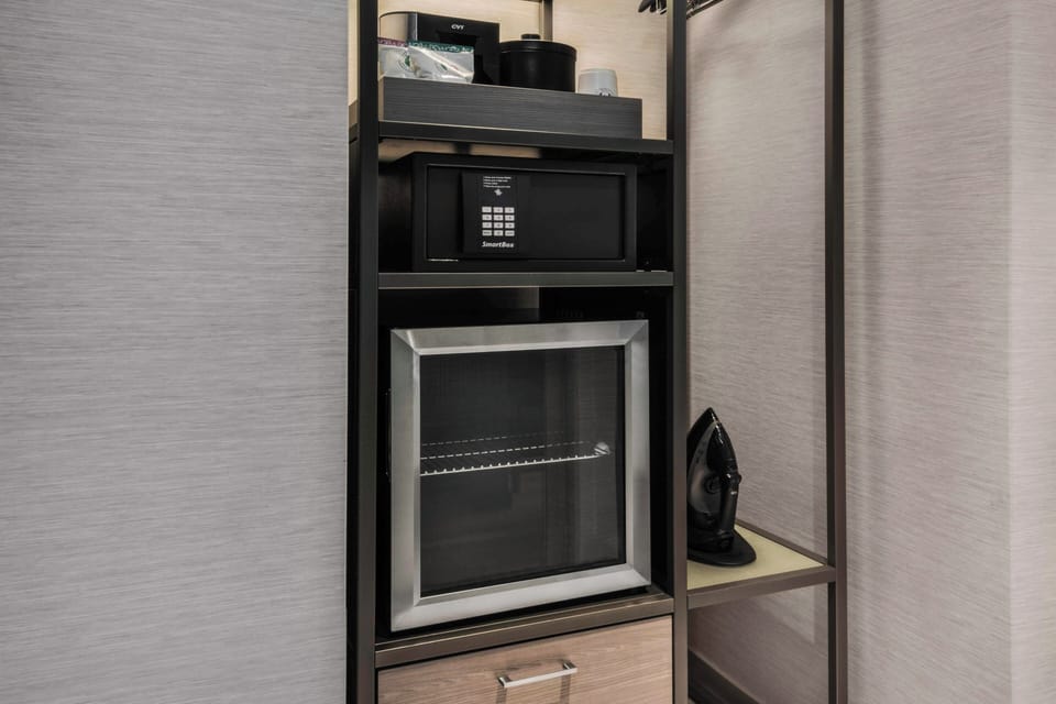 Desk, laptop workspace, blackout drapes, iron/ironing board