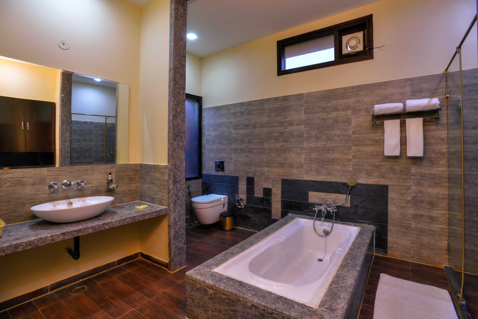 Premium Room, 1 King Bed, Garden View | Bathroom | Separate tub and shower, deep soaking tub, rainfall showerhead