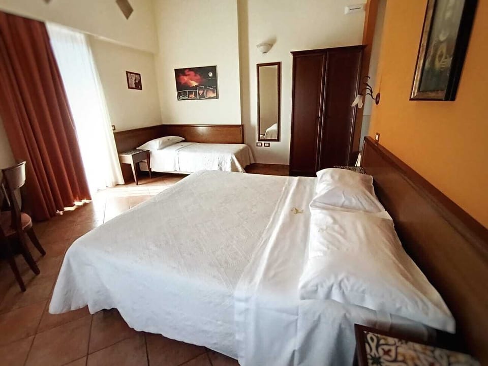Triple Room | Minibar, in-room safe, desk, soundproofing