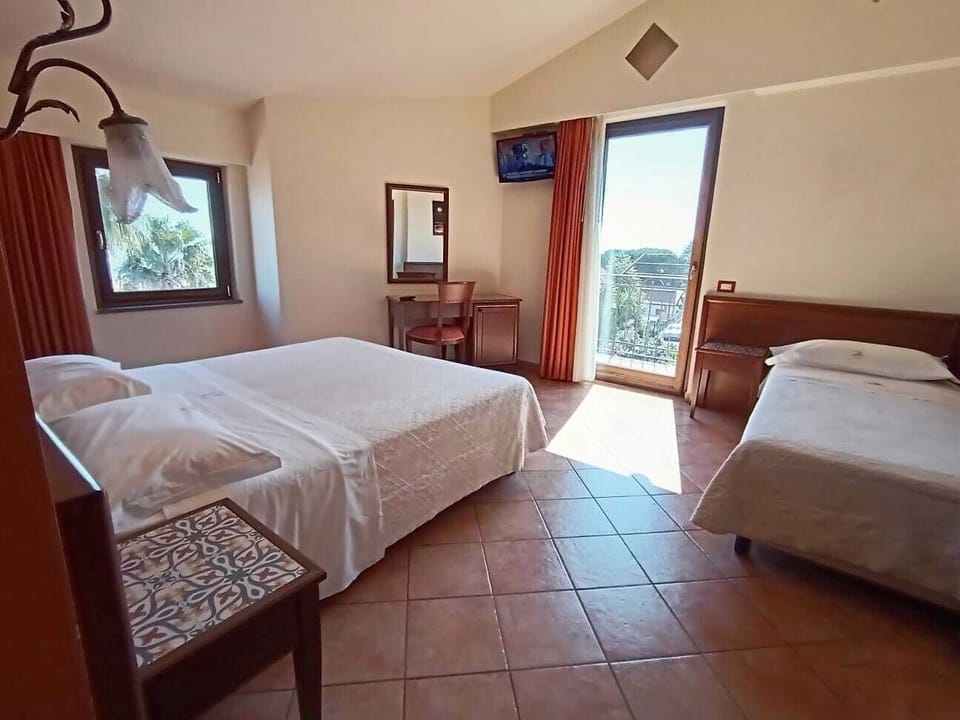 Triple Room | Minibar, in-room safe, desk, soundproofing