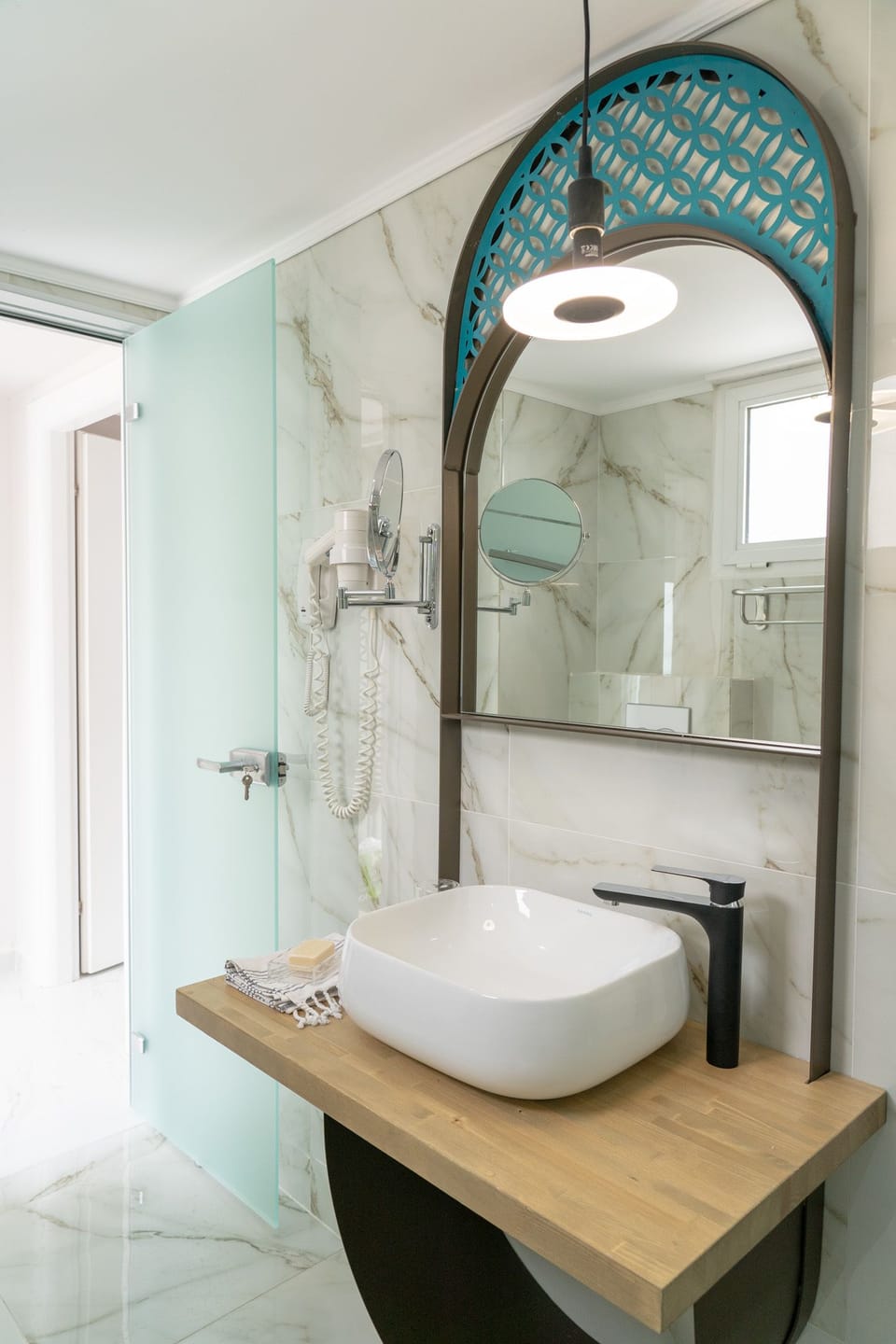 Designer toiletries, hair dryer, bathrobes, slippers