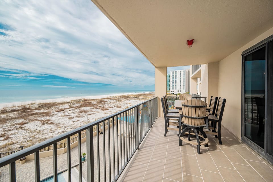 Savor meals at the outdoor dining set while enjoying views of the beach and tranquil waters just a few steps away