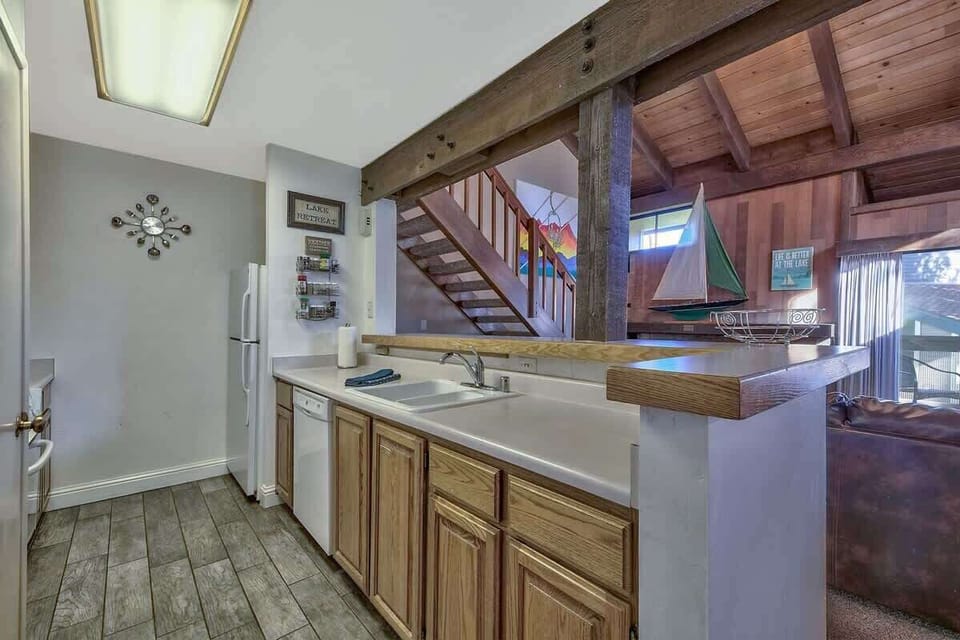 Bright, functional kitchen with rustic touches—perfect for cooking meals and staying connected to the cozy living space.
