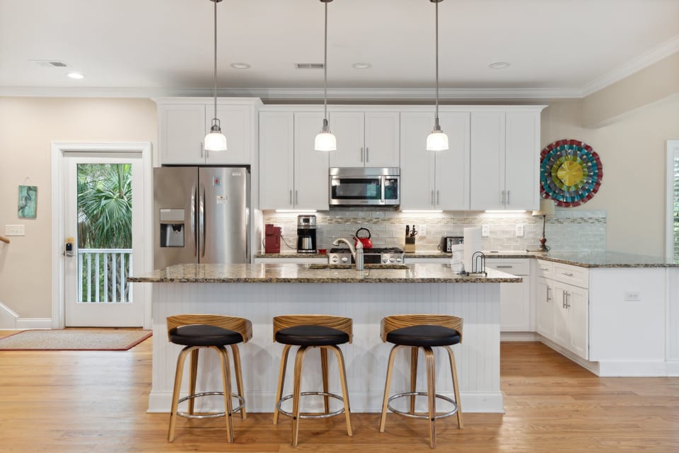 Fully stocked kitchen with bar seating