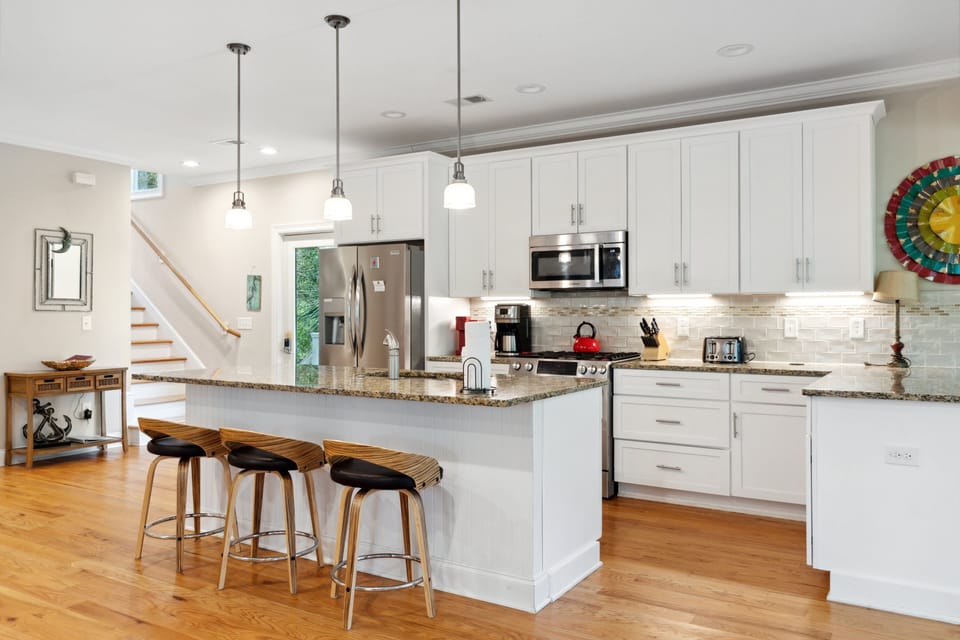 Fully stocked kitchen with bar seating