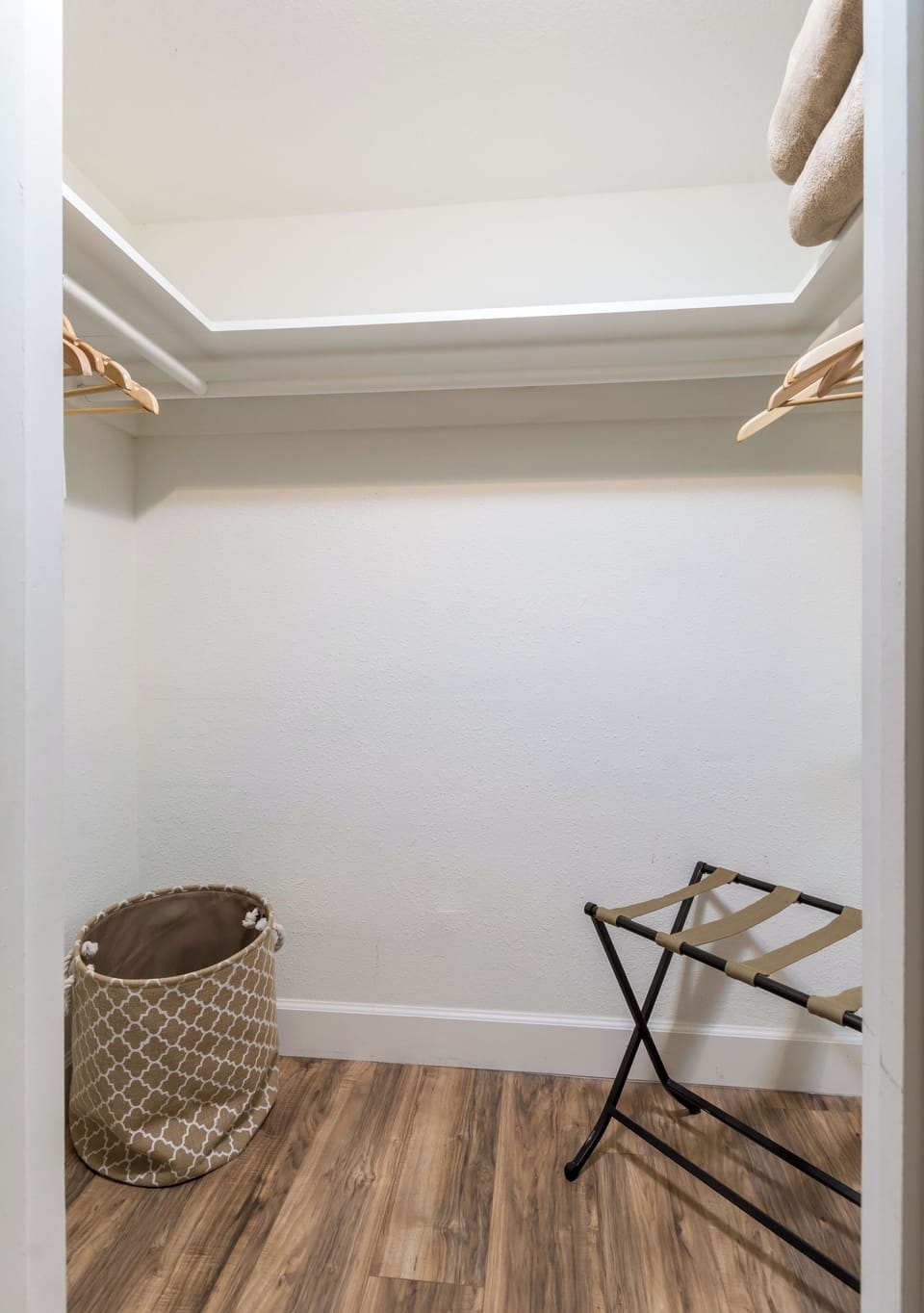 Walk-in closet!  Plenty of hangers, luggage rack, ironing board and luxury robes